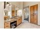 Well-lit bathroom with dual vanity and a storage cabinet at 13502 E Jomax Rd, Scottsdale, AZ 85262