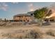 Rear exterior view of the property with desert landscaping and beautiful sunset sky at 13502 E Jomax Rd, Scottsdale, AZ 85262