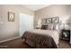 Comfortable bedroom with a queen bed and a closet at 14000 N 94Th St # 1118, Scottsdale, AZ 85260