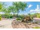 Beautiful community park with a rock waterfall feature, walking paths, and shaded seating areas at 14000 N 94Th St # 1118, Scottsdale, AZ 85260