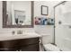 Bathroom with a white vanity and glass enclosed shower at 14296 W Surrey Dr, Surprise, AZ 85379