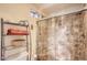 Tiled walk-in shower with glass door, shelf and seating; a bright and relaxing space at 15034 N 54Th St, Scottsdale, AZ 85254