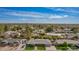 Aerial view shows a home with a well-kept lawn, mature trees, and is located in a suburban neighborhood at 1541 E Hope St, Mesa, AZ 85203