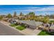 Aerial view of a property with a well-manicured lawn, mature landscaping, and a basketball hoop at 1541 E Hope St, Mesa, AZ 85203