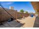 Fenced backyard with a concrete block wall for privacy at 1541 E Hope St, Mesa, AZ 85203