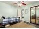 Bright bedroom with a closet, neutral walls, and a fan for those warm nights at 1541 E Hope St, Mesa, AZ 85203