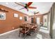 Cozy dining room with seating for eight, tile floors, and natural lighting at 1541 E Hope St, Mesa, AZ 85203