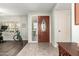 Inviting entryway with decorative glass door, tiled floor, and neutral paint at 1541 E Hope St, Mesa, AZ 85203