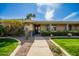 Inviting front entrance with desert landscaping, including a large cactus, and a well-maintained walkway at 1541 E Hope St, Mesa, AZ 85203