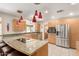 Bright kitchen with stainless steel appliances, granite countertops, and a large island at 1541 E Hope St, Mesa, AZ 85203