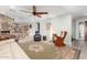 Spacious living room features a ceiling fan, stone accent wall, and neutral color palette at 1541 E Hope St, Mesa, AZ 85203