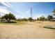 Expansive grassy park with mature trees and power lines overhead at 1541 E Hope St, Mesa, AZ 85203