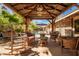 Relaxing outdoor patio with ample seating, stone accents, and shade at 1541 E Hope St, Mesa, AZ 85203