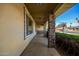 Covered porch featuring stone pillar accents, providing a shaded and stylish entryway to the home at 1541 E Hope St, Mesa, AZ 85203