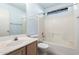 Upstairs bathroom featuring a bath and shower with a modern sink and vanity at 15601 W Hammond Dr, Goodyear, AZ 85338