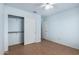 Clean bedroom featuring a closet with sliding doors and neutral flooring at 15601 W Hammond Dr, Goodyear, AZ 85338