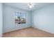 Bright bedroom with natural light and a street view at 15601 W Hammond Dr, Goodyear, AZ 85338