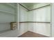 Walk-in closet with shelving and space for storage boxes and hanging clothes at 15601 W Hammond Dr, Goodyear, AZ 85338