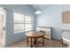 Breakfast nook with a wooden table and a cabinet against the wall at 15601 W Hammond Dr, Goodyear, AZ 85338