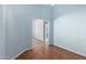 Hallway showcasing the home's layout and hardwood flooring at 15601 W Hammond Dr, Goodyear, AZ 85338