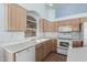 Kitchen with an arched window over the sink, offering natural light at 15601 W Hammond Dr, Goodyear, AZ 85338