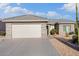 Charming single-story home with a two-car garage and desert landscaping at 16200 W Hearthstone Dr, Surprise, AZ 85374