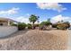 Lush desert landscaping in the front yard adds curb appeal at 16200 W Hearthstone Dr, Surprise, AZ 85374