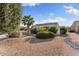 Charming front yard with desert landscaping and mature trees at 16200 W Hearthstone Dr, Surprise, AZ 85374