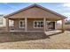 Covered patio with porch and view of the home from the backyard at 17192 W Post Dr, Surprise, AZ 85388