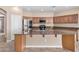 Gourmet kitchen featuring an island with granite countertops and modern stainless steel appliances at 17192 W Post Dr, Surprise, AZ 85388