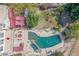 Aerial view of pool with rock features, pool-side seating, and manicured landscaping, creating a private oasis at 1831 W San Angelo St, Gilbert, AZ 85233