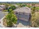 An elevated view showcases a well-maintained house with a sprawling driveway and perfectly manicured landscaping in a prime location at 1831 W San Angelo St, Gilbert, AZ 85233