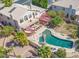 A beautiful backyard featuring a sparkling pool, spa, firepit, and an elevated deck perfect for entertaining or relaxation at 1831 W San Angelo St, Gilbert, AZ 85233