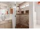 Modern walk-in shower with bench and decorative tile in bright bathroom at 1831 W San Angelo St, Gilbert, AZ 85233