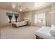 Spacious bedroom featuring large windows, two beds, and neutral carpeting at 1831 W San Angelo St, Gilbert, AZ 85233