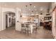 Well-lit kitchen with a breakfast bar, seamlessly connecting to living spaces, perfect for modern living and entertaining guests at 1831 W San Angelo St, Gilbert, AZ 85233