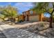 Charming home with a brick-paved driveway, desert landscaping, and a warm, inviting facade under a sunny sky at 2463 E Stacey Rd, Gilbert, AZ 85298