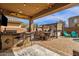 Spacious patio with built-in bar, dining area, and views of the pool at 2463 E Stacey Rd, Gilbert, AZ 85298