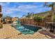 Backyard swimming pool and hot tub with mature landscaping, dining and relaxing areas at 2463 E Stacey Rd, Gilbert, AZ 85298