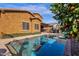 Backyard swimming pool with mature landscaping and views of home at 2463 E Stacey Rd, Gilbert, AZ 85298