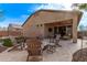 Inviting backyard featuring a cozy fire pit area and a covered patio for outdoor relaxation at 25907 N 134Th Dr, Peoria, AZ 85383