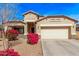 Inviting single-story home featuring a two-car garage and desert landscaping with bright pink bougainvillea bushes at 25907 N 134Th Dr, Peoria, AZ 85383