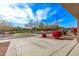 View from the front of the house, showcasing the neighborhood's park, mature trees and walking trail at 25907 N 134Th Dr, Peoria, AZ 85383