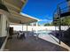 Poolside view with a covered patio and spiral staircase at 2946 E Flower St, Phoenix, AZ 85016