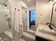 Modern bathroom with a glass shower featuring bronze fixtures and a view into the bedroom at 2946 E Flower St, Phoenix, AZ 85016