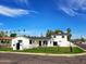 Charming updated house with a well-manicured lawn and black decorative fence at 2946 E Flower St, Phoenix, AZ 85016