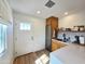 Entryway kitchen with stainless steel appliances, white countertops, and ample cabinet space at 2946 E Flower St, Phoenix, AZ 85016