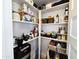 Walk-in pantry features organized shelving for storage and a Brio water dispenser at 2946 E Flower St, Phoenix, AZ 85016