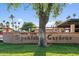 Spanish Gardens community entrance sign featuring well-maintained landscaping and palm trees at 3036 N 32Nd St # 314, Phoenix, AZ 85018