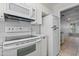 Clean, white kitchen featuring classic appliances and a bright, functional design at 3036 N 32Nd St # 314, Phoenix, AZ 85018